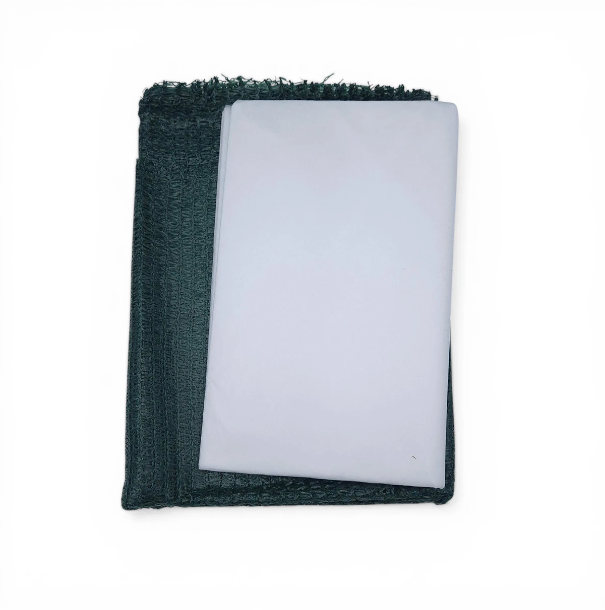 Folded dark-green textured towel with a light blue sheet draped on top.